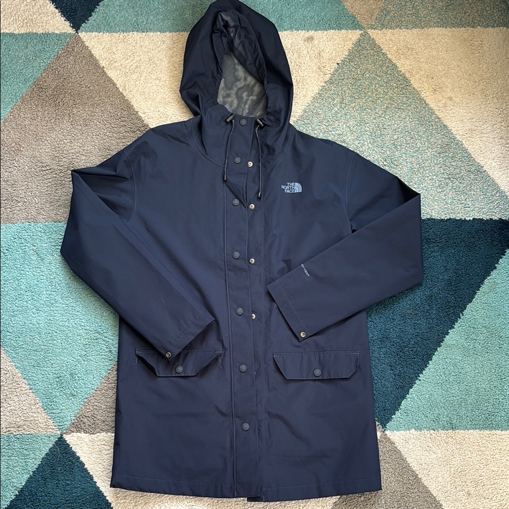 The North Face Blue Raincoat with Hood and Weather-Resistant Material
